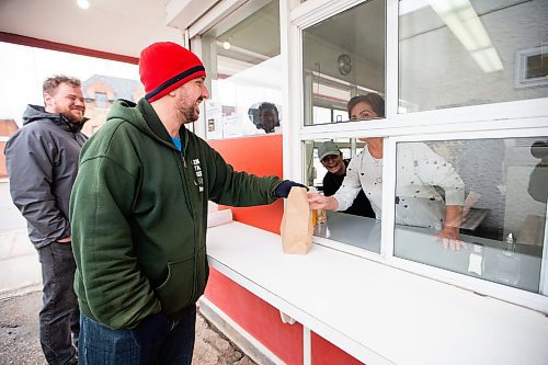 MIKAELA MACKENZIE / FREE PRESS

Joel Lebois takes his order at the newly re-opened Mrs. Mikes in St. Boniface on Thursday, April 18, 2024. 

For Gabby story.