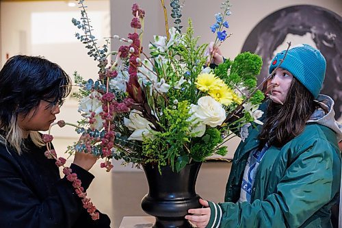 MIKE DEAL / FREE PRESS
Liana Montoya (left) and Kay Gillespie (right) students at the Exchange Met School put the finishing touches on their groups arraignment.
109 professional and amateur florists will interpret 94 artworks in the WAG-Qaumajuq collection, filling the galleries with fresh flowers.
240418 - Thursday, April 18, 2024.