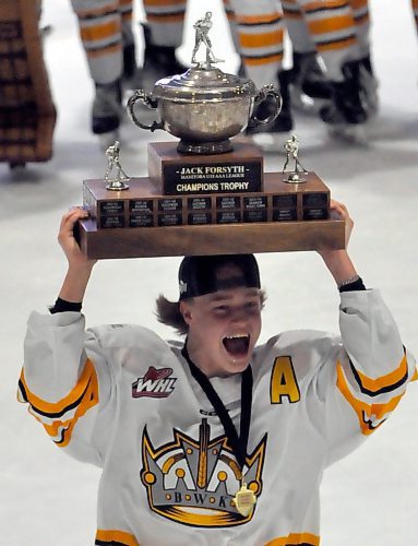 Wheat Kings assistant captain Dustin Bell (11) wants to lift a second trophy this season, here sharing it with fans at J&G Homes Arena after Brandon won the Manitoba U18 AAA Hockey League trophy after sweeping the Winnipeg Wild 3-0. He'd like to hoist the U18 Telus Cup after taking the trophy from captain and fellow D-man Owen Wallace. (Jules Xavier/The Brandon Sun)