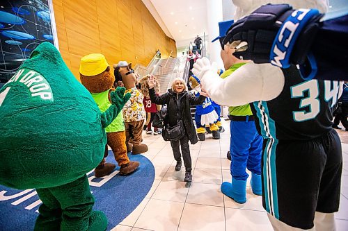 MIKAELA MACKENZIE / FREE PRESS

Aldene Rankin is greeted by nine local mascots as she arrives at the Winnipeg Richardson International Airport from Toronto on Friday, April 19, 2024. The event, put on by Tourism Winnipeg, was in celebration of Tourism Week.

Standup.