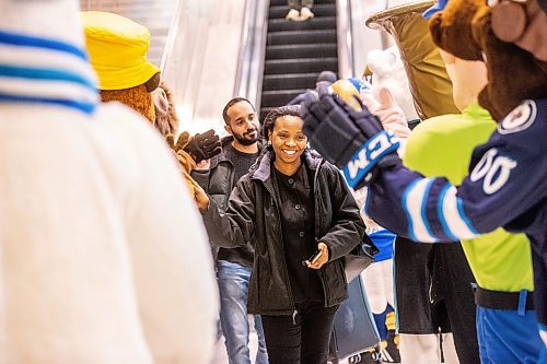 MIKAELA MACKENZIE / FREE PRESS

Femi Ajani is greeted by nine local mascots as she arrives at the Winnipeg Richardson International Airport on Friday, April 19, 2024. The event, put on by Tourism Winnipeg, was in celebration of Tourism Week.

Standup.
