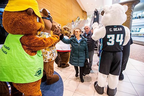 MIKAELA MACKENZIE / FREE PRESS

Helen McCormick is greeted by nine local mascots as she arrives home at the Winnipeg Richardson International Airport from Toronto on Friday, April 19, 2024. The event, put on by Tourism Winnipeg, was in celebration of Tourism Week.

Standup.
