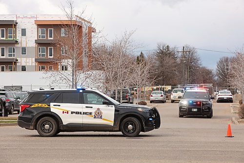 22042024
Brandon Police Service vehicles block a section of the westbound lanes of Victoria Avenue in between 23rd Street and 25th Street on Monday after a car versus pedestrian collision. 
(Tim Smith/The Brandon Sun)