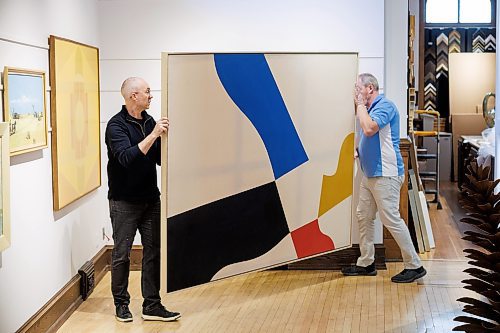 MIKE DEAL / FREE PRESS
Shaun Mayberry (left) and Allan Mayberry (right) prepare to hang Kenneth Lochhead&#x2019;s Wide Inside (AC-33) which will be one of the fourteen paintings going to auction from the WAG-Quamajuq.
WAG-Quamajuq is auctioning some more paintings to raise money for future contemporary art purchases.
The paintings will be on display at the Mayberry Fine Art gallery at 212 McDermot Avenue, from May 1-4 to allow potential buyers from Winnipeg &#x2014; there are several Manitoba artists' paintings also to be auctioned &#x2014; a chance to view them as well as art enthusiasts or the curious.
See Alan Small story
240423 - Tuesday, April 23, 2024.