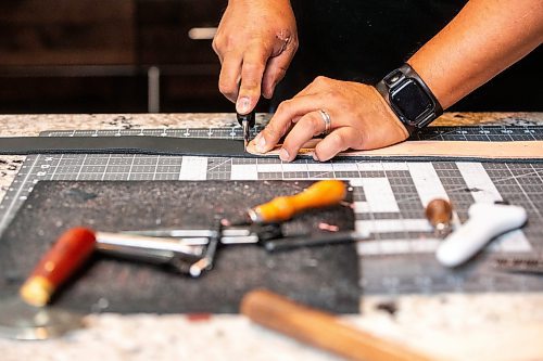 MIKAELA MACKENZIE / FREE PRESS

Cecil Sveinson of Buffalo Dancer Designs works on a piece in his basement studio on Tuesday, April 16, 2024. Sveinson makes ceremonial belts for powwow dancers and other leather goods.

For AV story.