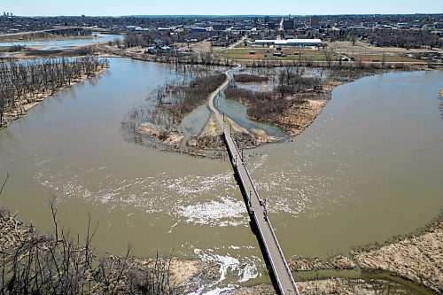 Water from the swollen Assiniboine River floods low-lying areas bordering the riverbanks in Brandon on Tuesday. (Tim Smith/The Brandon Sun)