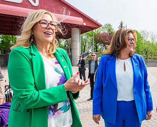 MIKAELA MACKENZIE / WINNIPEG FREE PRESS
 
Families Minister and minister responsible for gender equity Rochelle Squires (left), premier Heather Stefanson, 
and president of Pride Winnipeg Barry Karlenzig chat before making an announcement about Pride funding at The Forks on Tuesday, May 23, 2023. 

Winnipeg Free Press 2023.