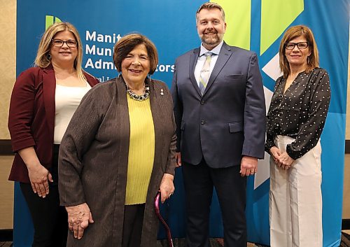 Manitoba Lt.-Gov. Anita Neville (centre-left) meets with Manitoba Municipal Administrators vice-president Nicole Chychota (left), president Duane Nicol (centre-right) and executive director Adrienne Bestland ahead of the organization's first-ever leadership summit at the Victoria Inn in Brandon on Friday morning. (Colin Slark/The Brandon Sun)