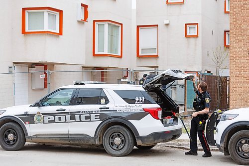 MIKE DEAL / FREE PRESS
Winnipeg Police Service officers at Centre Village, 575 Balmoral Street, where a deceased person was found shortly before the Manitoba government was to hold a housing announcement at the site.
See Erik Pindera story
240426 - Friday, April 26, 2024.