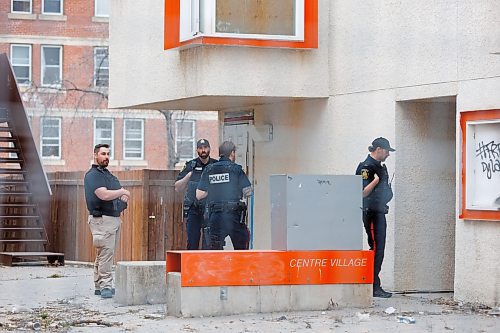 MIKE DEAL / FREE PRESS
Winnipeg Police Service officers at Centre Village, 575 Balmoral Street, where a deceased person was found shortly before the Manitoba government was to hold a housing announcement at the site.
See Erik Pindera story
240426 - Friday, April 26, 2024.