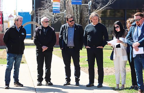 Ron Kostyshyn, Manitoba's Agriculture Minister (far left) listens as the names of Manitobans are read out loud, who died last year after suffering injuries or illness at work. Joining Kostyshyn for the National Day of Mourning ceremony held outside Brandon City Hall on Sunday were Garnet Boyd, Brandon and District Labour Council treasurer, Glen Simard, Brandon East NDP MLA and Sport, Culture, Heritage and Tourism Minister, and Jeff Fawcett, Brandon Mayor. (Michele McDougall/The Brandon Sun)
