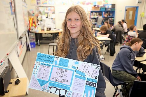 Linden Lanes School Grade 8 student Katelyn Rossnagel with the poster she and a classmate created that won an award in the Prairie Mountain Health Project Reset Initiative, which encourages healthy screen habits, digital safety and digital literacy. (Tim Smith/The Brandon Sun)

