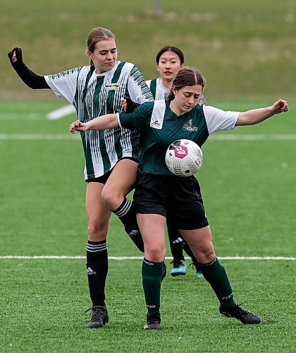 JOHN WOODS / FREE PRESS
Linden Christian Wings Lily Rempel (15), left, defends against St. Boniface Diocesan Centurions Heleyna Moniz (10) during first half action in the season opening exhibition varsity game at Ralph Cantafio Soccer Complex Monday, April 29, 2024. 

Reporter: ?