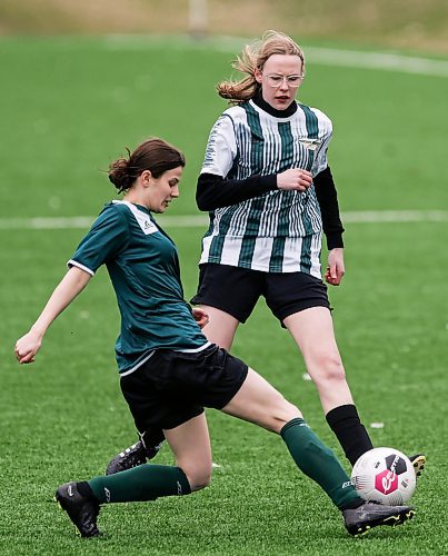 JOHN WOODS / FREE PRESS
Linden Christian Wings Veronica Johnson (18), right,  defends against St. Boniface Diocesan Centurions Anna Kolebaba (4) during first half action in the season opening exhibition varsity game at Ralph Cantafio Soccer Complex Monday, April 29, 2024. 

Reporter: ?