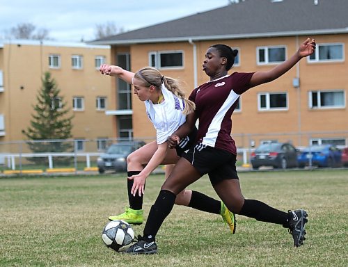 Rebecca Alebiosu, right, of the Crocus Plainsmen challenges Vincent Massey's Jordan Woloski for the ball. (Thomas Friesen/The Brandon Sun)