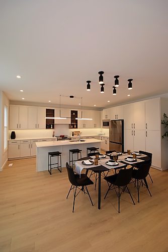 Todd Lewys / Free Press
A study in functional elegance, the dining area and kitchen in this Bison Run home is perfect for entertaining.