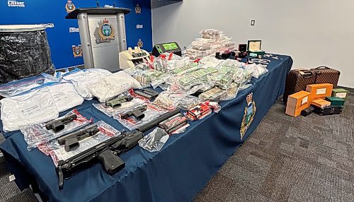 Tyler Searle / Free Press
Police seized $1.7 million in cash, 30 kg of cocaine, four handguns, a submachine-gun with a silencer, and ammunition. 
May 1/2024