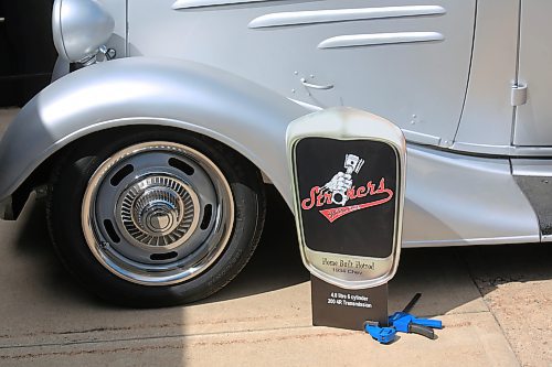 Strokers Social Club sign with truck details in front of Gray's 1934 hotrod. (Charlotte McConkey/The Brandon Sun)