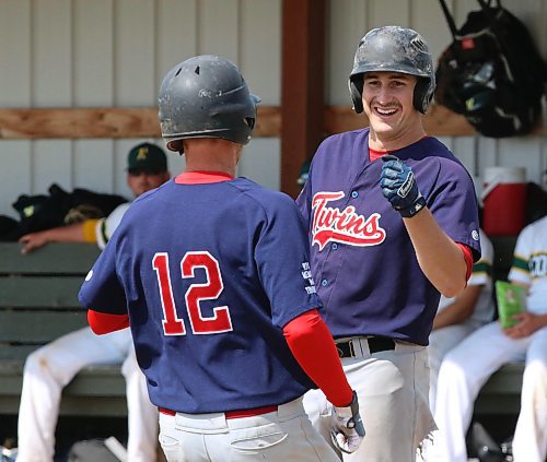 Ty Enns celebrates with his Cartwright Twins teammate Drew Haight after Haight's solo home run in the first inning against the Rivers Comets in the final of Baseball Manitoba's AA provincials in Rivers in 2022. The Twins were unable to repeat as Border Baseball League champions, falling in the final to the Winkler Whips last season. (Perry Bergson/The Brandon Sun)