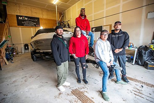 MIKAELA MACKENZIE / FREE PRESS

Anthony dela Cruz (left), Alexis Tachnak, Quinnell Joseph, Michael Richard, and Daniel Hidalgo with Community204&#x573; new boat, which will be used to patrol waterways to offer safety and support to people living in encampments near riverbanks, at the shop where it will be getting logos applied on Thursday, May 2, 2024. 


For Tyler story.