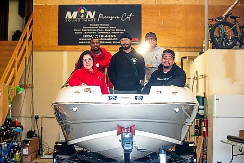 MIKAELA MACKENZIE / FREE PRESS

Alexis Tachnak (left), Quinnell Joseph, Anthony dela Cruz, Michael Richard, and Daniel Hidalgo with Community204&#x573; new boat, which will be used to patrol waterways to offer safety and support to people living in encampments near riverbanks, at the shop where it will be getting logos applied on Thursday, May 2, 2024. 


For Tyler story.