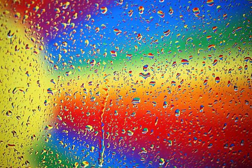 02052024
The colourful rainbow mural in an alleyway along Rosser Avenue in downtown Brandon is refracted by raindrops on a car window during showers on Thursday afternoon.
(Tim Smith/The Brandon Sun)