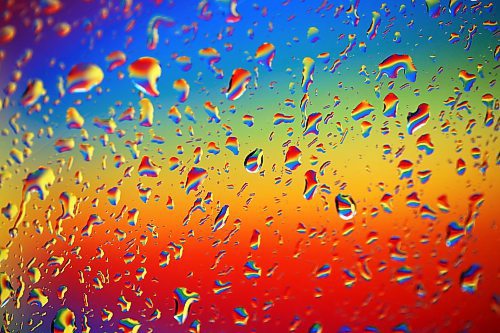 02052024
The colourful rainbow mural in an alleyway along Rosser Avenue in downtown Brandon is refracted by raindrops on a car window during showers on Thursday afternoon.
(Tim Smith/The Brandon Sun)