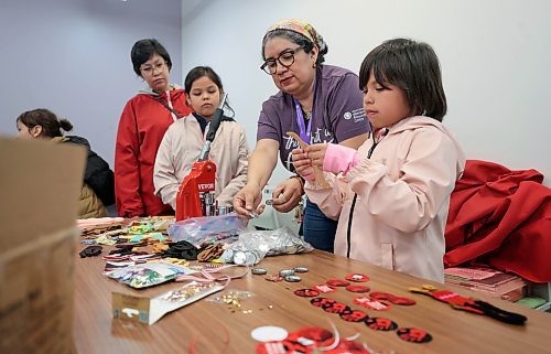 Ruth Bonneville / Free Press

LOCAL STDUP - Red Dress

Oriana Conde, Programs Coordinator at the West End Women's Resource Centre, teaches kids and attendees how to make buttons at a special workshop in recognition of MMIWG2S Thursday.  

She also showed them how to do beading on faceless dolls which will go on display at the centre to bring awareness for the upcoming Red Dress Day and rally. 

Note: Photos were fine but no specific names were provided for the people in the photo aside from the coordinator. 

May 2nd,  2024
