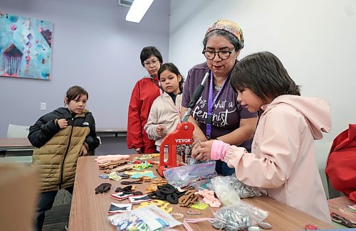 Ruth Bonneville / Free Press

LOCAL STDUP - Red Dress

Oriana Conde, Programs Coordinator at the West End Women's Resource Centre, teaches kids and attendees how to make buttons at a special workshop in recognition of MMIWG2S Thursday.  

She also showed them how to do beading on faceless dolls which will go on display at the centre to bring awareness for the upcoming Red Dress Day and rally. 

Note: Photos were fine but no specific names were provided for the people in the photo aside from the coordinator. 

May 2nd,  2024
