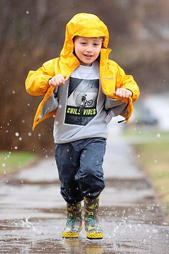 02052024
Four-year-old Kieran MacMillan plays in a puddle outside his home in Minnedosa on a rainy Thursday afternoon. (Tim Smith/The Brandon Sun)