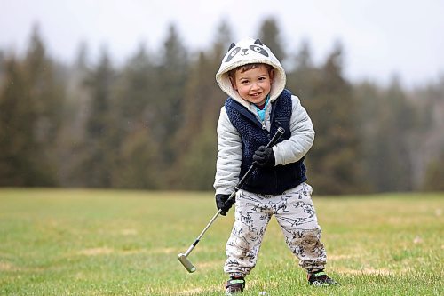 03052024
Three-year-old Ledger Goodman practices his golf swing while out with his dad Bobby on opening day at the Clear Lake Golf Course on a rainy Friday afternoon. 
(Tim Smith/The Brandon Sun) 