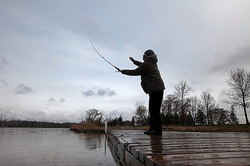 03052024
Spade Uchendu doesn&#x2019;t let the wet weather discourage him from fishing from the dock at Dinsdale Park on Friday morning. 
(Tim Smith/The Brandon Sun) 