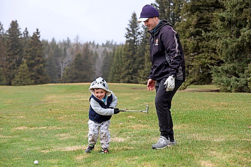 03052024
Bobby Goodman and his three-year-old son Ledger take advantage of opening day at the Clear Lake Golf Course to play some golf on a rainy Friday afternoon. 
(Tim Smith/The Brandon Sun) 