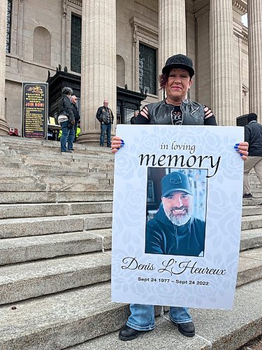 GABRIELLE PICHE / FREE PRESS
Lise Léveillé holds a sign for her late husband Denis L’Heureux. Léveillé has been advocating for greater safety for motorcyclists on roads since her partner’s collision