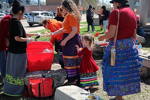 At the end of the ceremony, organizers gave out food to those gathered. There was also tobacco available for smudging. Amy Chegus and her daughter Nevaeh Danielson in rainbow skirts. (Charlotte McConkey/The Brandon Sun)
