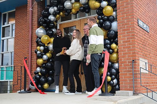 Pastor Ben Karuhije and his wife cut the ribbon out front of Cities Church at the grand opening on Saturday. Previously St. George's Anglican Church, the building had been under renovation since October. That work was completed last week. (Photos by Charlotte McConkey/The Brandon Sun)
