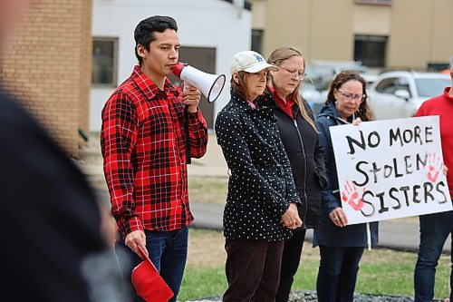 Gary Caribou (left), a first-year sociology student at Brandon University, shares an emotional story of loss in BU’s Kavanagh Courtyard, where more than 30 community members gathered on Monday to commemorate the National Day of Awareness for Missing and Murdered Indigenous Women, Girls and Two-Spirit People. (Abiola Odutola/The Brandon Sun)