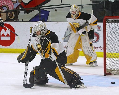 Brandon Wheat Kings under-15 AAA goalie Urijah Moosetail, shown in action during warmup during the 2022-23 season as Brady Shields looks on, lost just three games last season as his club won the provincial U15 title for the third year in a row. (Perry Bergson/The Brandon Sun)