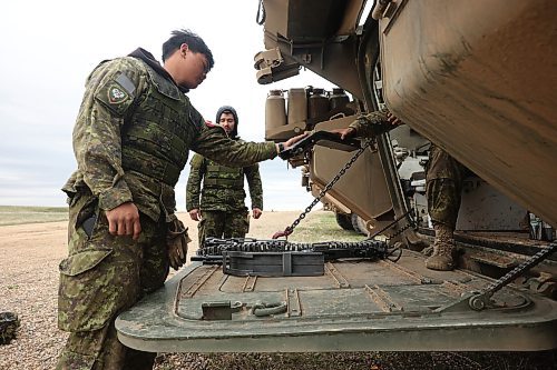 Soldiers with the 2nd Battalion, Princess Patricia's Canadian Light Infantry check over weaponry while taking part in live-fire training using LAV 6 armoured fighting vehicles at the CFB Shilo range on Monday. (Tim Smith/The Brandon Sun)