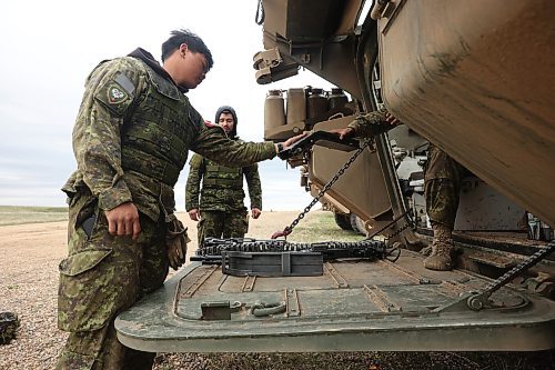 06052024
Soldiers with the 2nd Battalion, Princess Patricia's Canadian Light Infantry check over weaponry while taking part in live-fire training using LAV 6 armoured fighting vehicles at the CFB Shilo range on Monday.    (Tim Smith/The Brandon Sun)