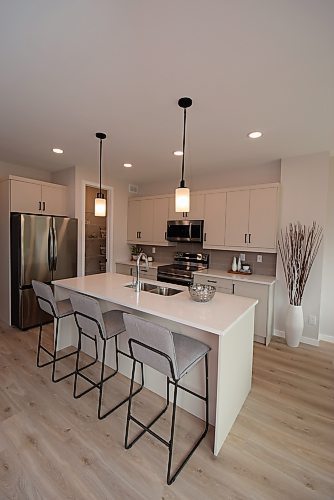 Todd Lewys / Free Press
The island kitchen in this roomy Sage Creek townhome is stylish and functional. 