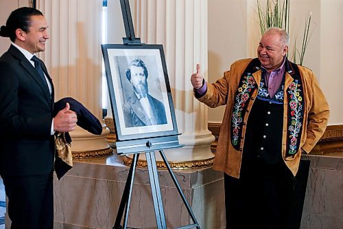 JOHN WOODS / FREE PRESS
Manitoba Métis Federation president David Chartrand gives a thumbs up to Premier Wab Kinew after unveiling a photo of Louis Riel Day which recognizes him as the first premier of Manitoba at the Manitoba legislature Monday, February 19, 2024. 

Reporter: nicole