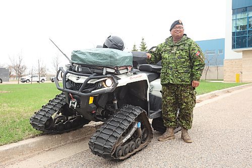 Capt. Sam Agustin, a chaplain with 2nd Battalion, Canadian Light Infantry (2PPCLI), poses with his Can-Am Outlander ATV at CFB Shilo. Agustin drives the ATV year-round and is well known on base because of his unique ride. (Tim Smith/The Brandon Sun)