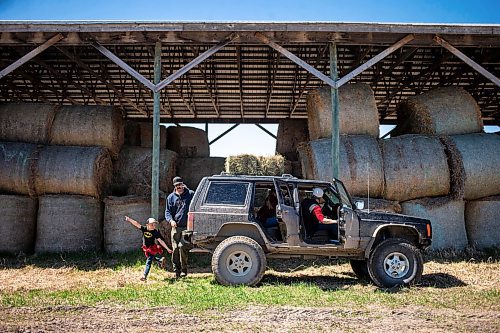 MIKAELA MACKENZIE / FREE PRESS

Jonathan Bouw and his family pile into the Jeep to drop off a couple of square bales in the calving pasture on Edie Creek Angus ranch near Anola on Wednesday, May 8, 2024. 


