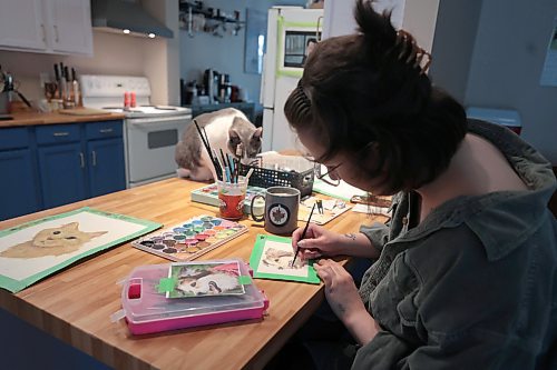 Ruth Bonneville / Free Press
49.8 - Creators - pet portraits
Journalist portraits of local artist, Annick Svistovski, working from home on painting portraits of pets from a photo her clients have provided for her. Her house cats love to hang around while she works.
Name of cat in this photo: Monty
Story: 49.8 The Creators: Pet Portrait Artist
Annick is a painter who specializes in painting animal portraits from pictures which her clients send her. Sheճ currently painted cats and dogs only but is hoping to be able to paint other pets.
Story by AV Kitching
May 9th, 2024