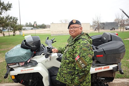 09052024
Captain Sam Agustin, Chaplain 2PPCLI with his Can-Am Outlander ATV at CFB Shilo. Agustin drives the ATV year-round and is well known on base because of his unique ride. (Tim Smith/The Brandon Sun)