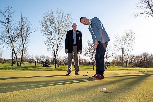BROOK JONES / FREE PRESS
Adam Speirs, 45, watches his putt as his dad Gavin Speirs, 79, calls the line of play while they duo fun together and test their golf skills on the putting green prior to being inducted into the Manitoba Golf Hall of Fame at the Breeszy Bend Country Club in Headingley, Man., Thursday, May 9, 2024. Adam was honoured for the class of 2023 and Gavin was honoured for the class of 2023.