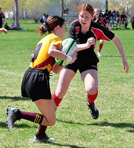 Crocus player Zhenaya Singfat eludes an incoming Swan Valley tackler en route to her first half try during her team's Friday afternoon 76-5 victory. (Jules Xavier/The Brandon Sun)