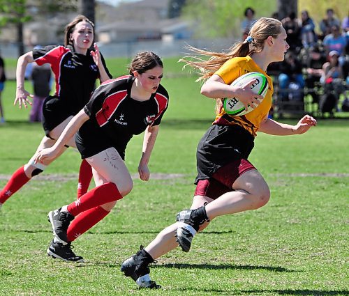 Once she finds open space, Faith Burtnick of the Crocus Plainsmen is tough to catch as she ran for three tries and added eight converts to pace her team to a 76-5 triumph over visiting Swan Valley. (Jules Xavier/The Brandon Sun)
