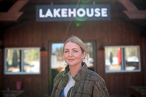 Karly McRae, president of Lakehouse Properties and the Clear Lake Country Destination Enrichment Organization, stands outside The Lakehouse restaurant in Wasagaming on Friday. McRae spoke about coming together as a community rather than focusing on divisiveness in the wake of the Parks Canada decision to ban all watercraft from Clear Lake for the 2024 season. (Tim Smith/The Brandon Sun)